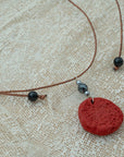 Handmade red clay pendant with hematite