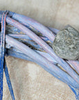 decorative wreath with seashells and pebbles