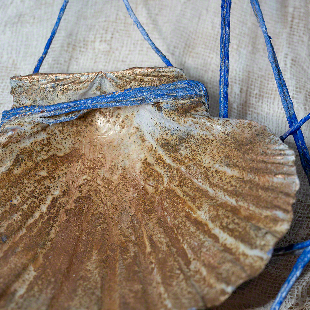 decorative wreath with seashells and pebbles