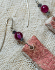 Clay earrings in red iridescent shades