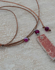Clay pendant in red iridescent shades