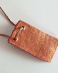 Handmade red-gold clay pendant