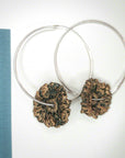 silver hoop earrings with crochet flower