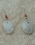 Handmade earrings with smooth white pebbles, accented with agate and hematite beads on silver hooks.