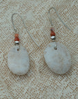 Handmade earrings with smooth white pebbles, accented with agate and hematite beads on silver hooks.