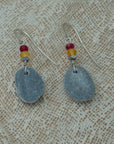 Handmade earrings with smooth gray pebbles, accented with red and yellow agate beads on silver hooks.