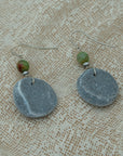 Handmade earrings with smooth round pebbles, accented with green agate and hematite beads on silver hooks.