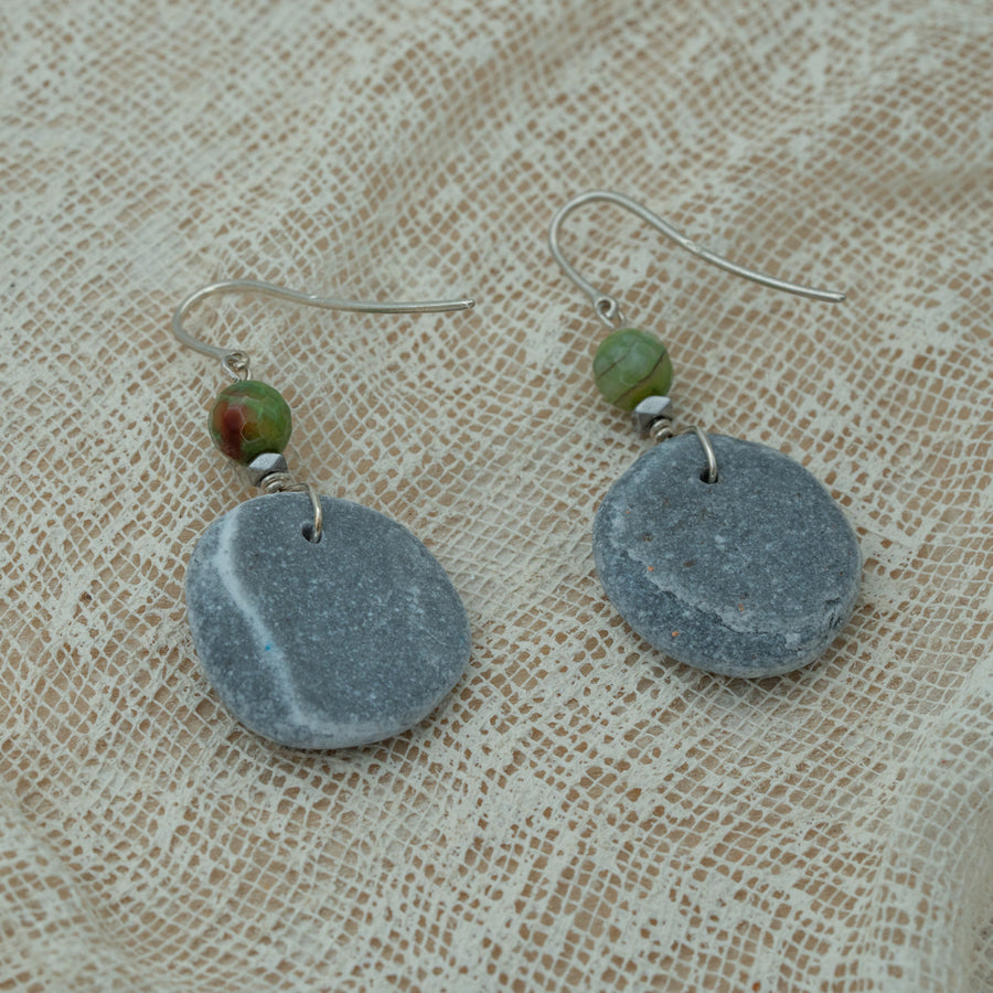 Handmade earrings with smooth round pebbles, accented with green agate and hematite beads on silver hooks.