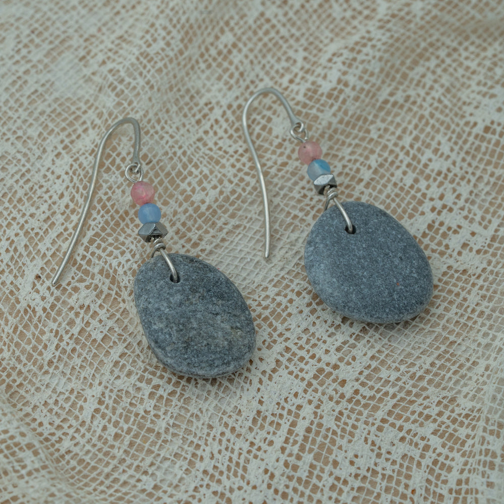 Handmade earrings with smooth gray pebbles, accented with pink agate and hematite beads on silver hooks