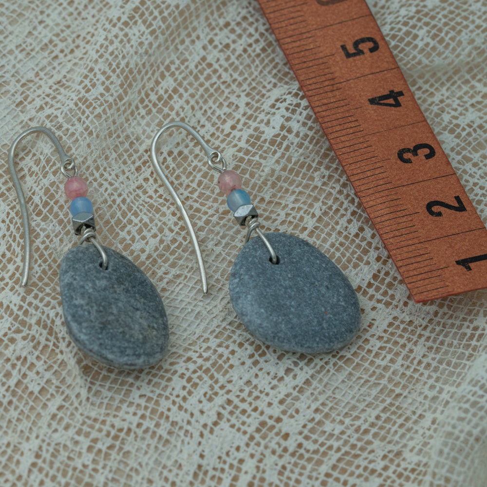 Handmade earrings with smooth gray pebbles, accented with pink agate and hematite beads on silver hooks