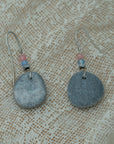 Handmade earrings with smooth gray pebbles, accented with pink agate and hematite beads on silver hooks