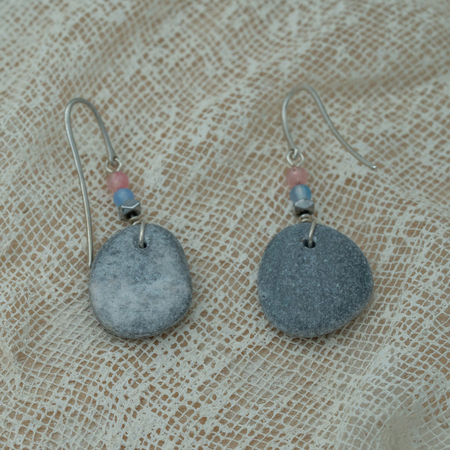 Handmade earrings with smooth gray pebbles, accented with pink agate and hematite beads on silver hooks