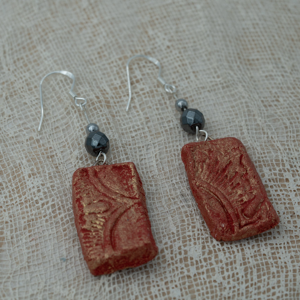 Handmade clay earrings with hematite