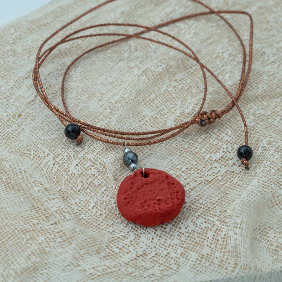 Handmade red clay pendant with hematite