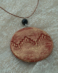 Handmade red-gold clay pendant