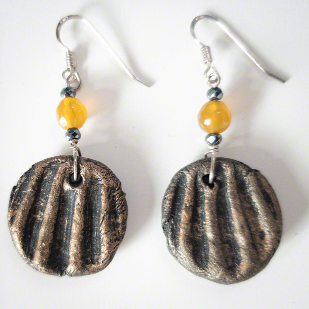 Handmade clay earrings in gold shades with hematite and agate