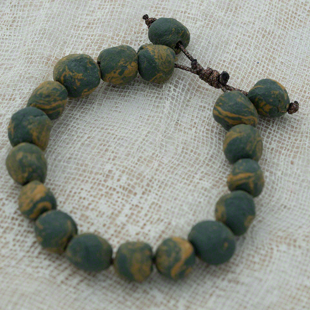 Bracelet with green-ochre handmade clay beads