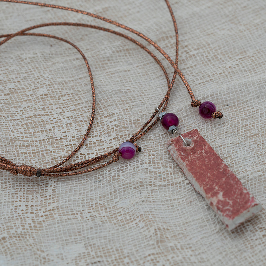 Clay pendant in red iridescent shades