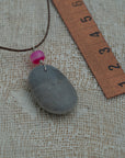 Grey sea pebble pendant with agate