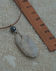 Sea pebble pendant with hematite