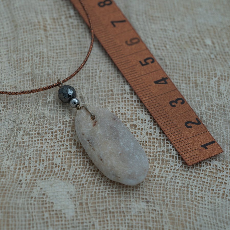 Sea pebble pendant with hematite