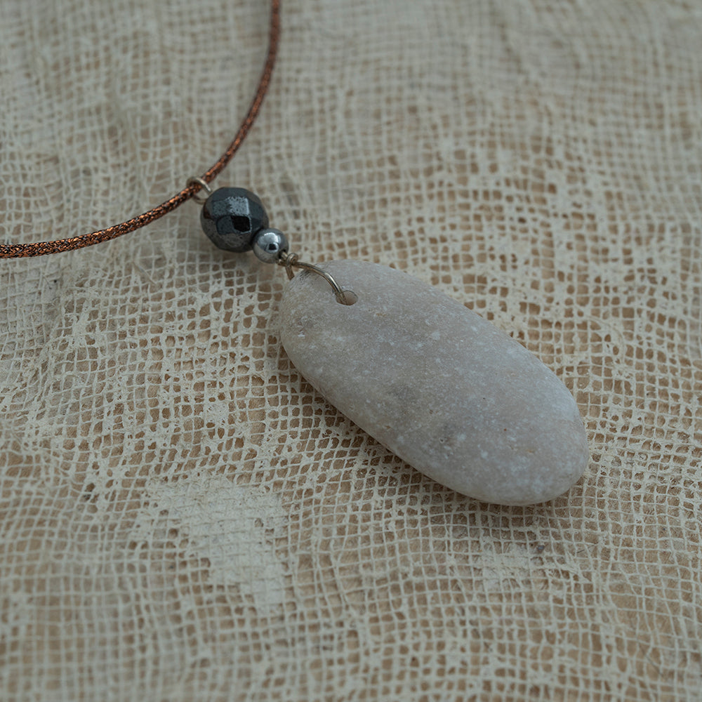 Sea pebble pendant with hematite