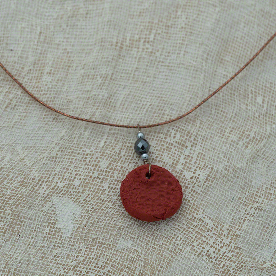 red clay pendant