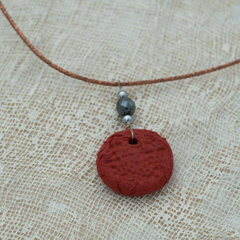 red clay pendant