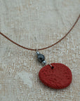Handmade red clay pendant with hematite