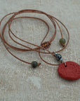 Handmade red clay pendant with hematite