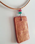 red gold clay pendant with agate