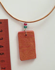 red gold clay pendant with agate