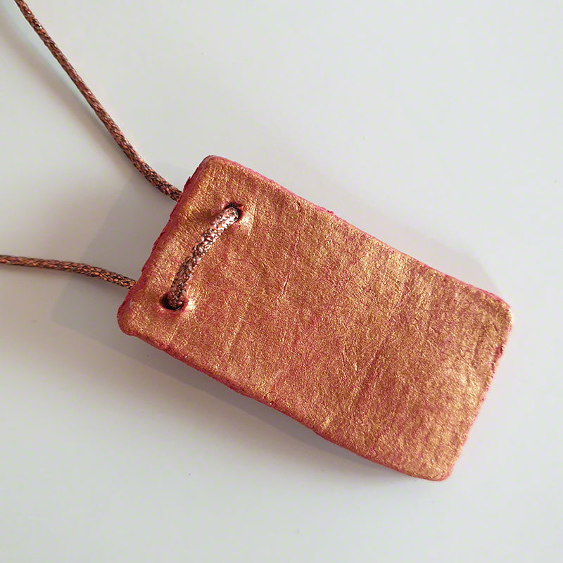 Handmade red-gold clay pendant