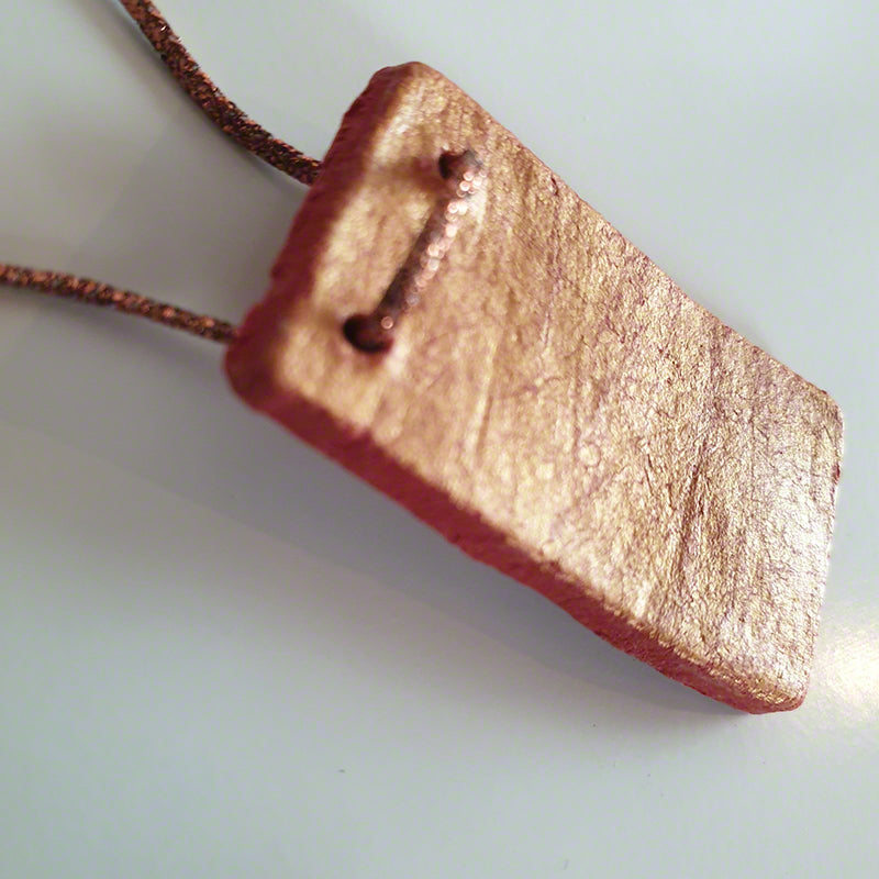 Handmade red-gold clay pendant