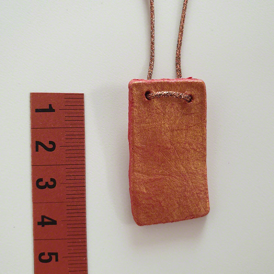 Handmade red-gold clay pendant