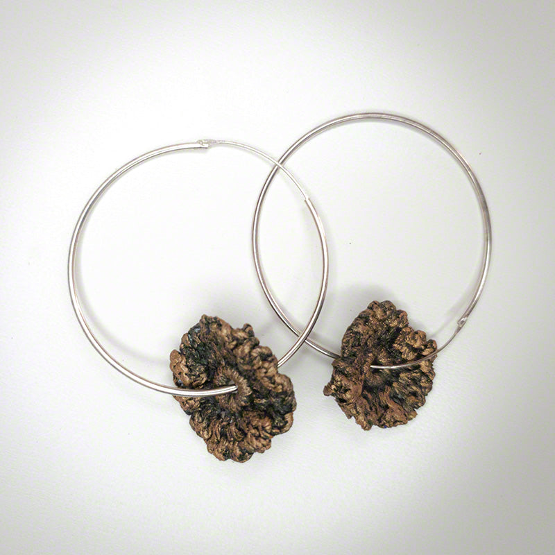 silver hoop earrings with crochet flower