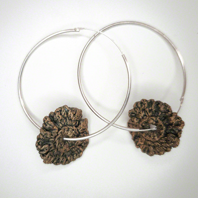silver hoop earrings with crochet flower