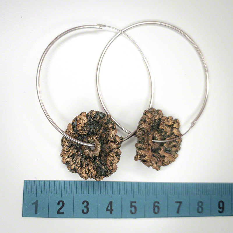 silver hoop earrings with crochet flower