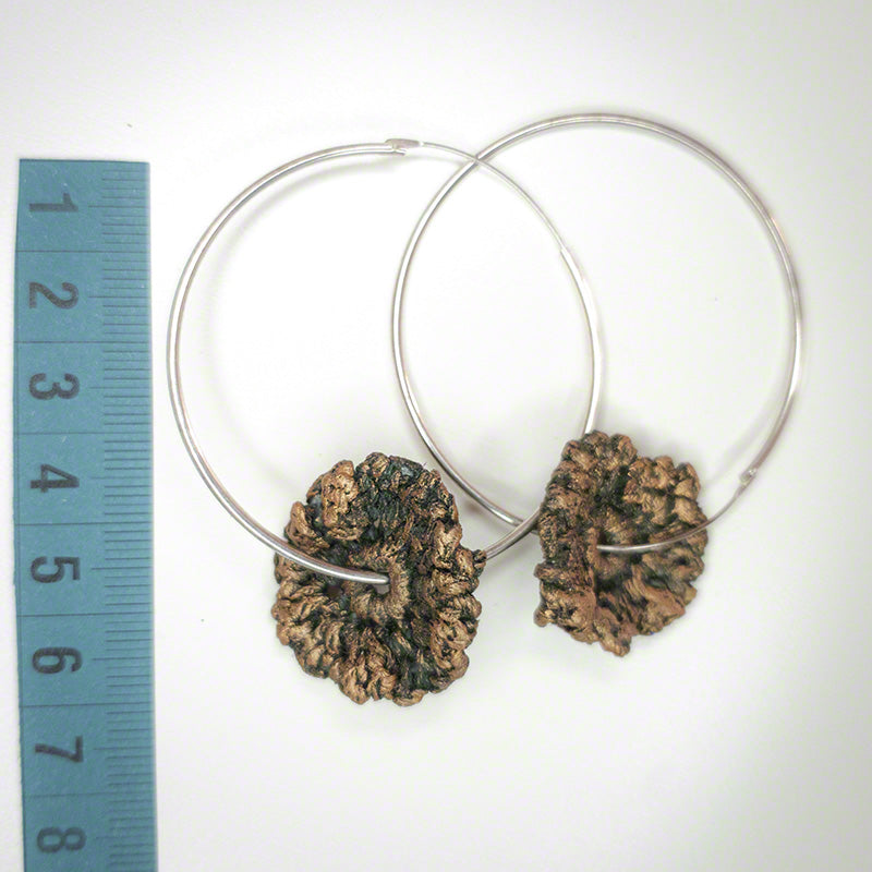 silver hoop earrings with crochet flower